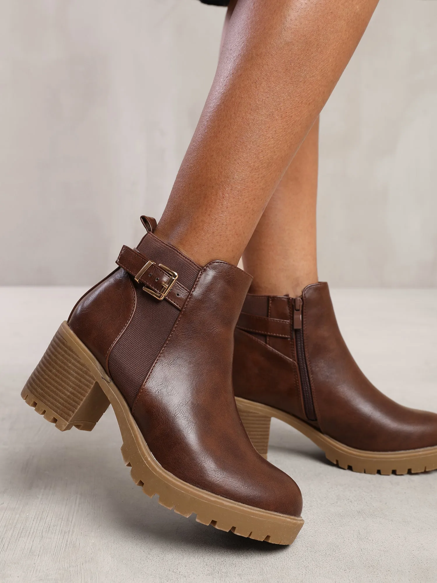 KALI MID BLOCK HEEL WITH BUCKLE DETAIL STRETCH ANKLE BOOTS IN BROWN FAUX LEATHER